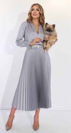 A suit with a pleated silk skirt