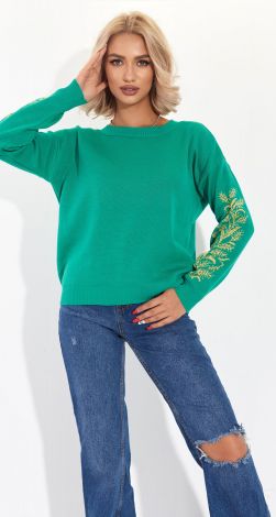 A beautiful sweater with an ornament on the sleeves