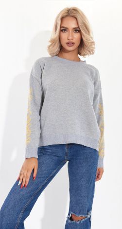 A beautiful sweater with an ornament on the sleeves