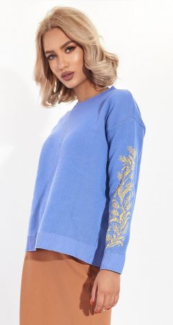 A beautiful sweater with an ornament on the sleeves