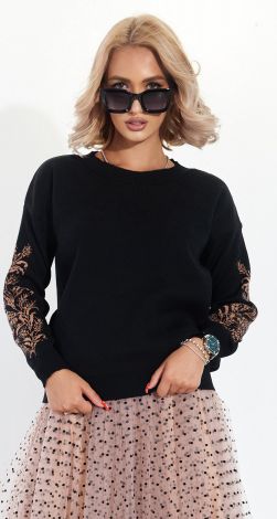 A beautiful sweater with an ornament on the sleeves