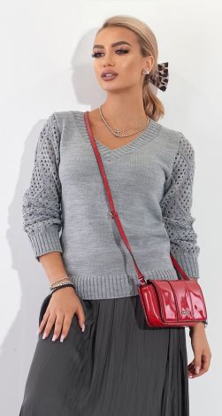 A beautiful sweater with an openwork sleeve