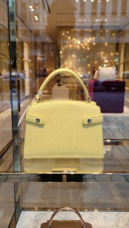A small yellow handbag