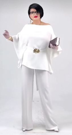 White pantsuit with an asymmetrical tunic blouse and belt