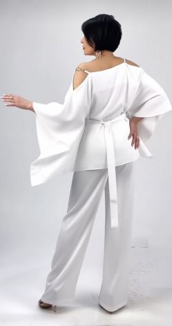 White pantsuit with an asymmetrical tunic blouse and belt
