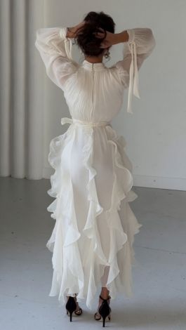 A luxurious, weightless white dress with ruffles