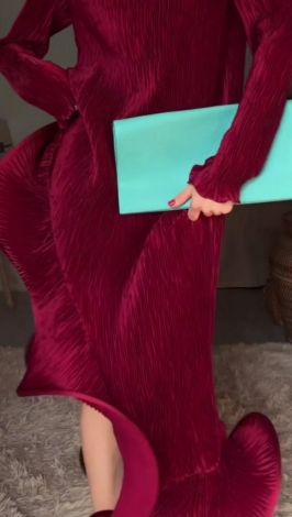 Burgundy silk pleated evening dress with a voluminous flounce