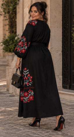 Black linen maxi dress with embroidery, a front slit, and a tasseled belt