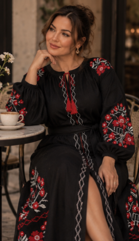Black linen maxi dress with embroidery, a front slit, and a tasseled belt