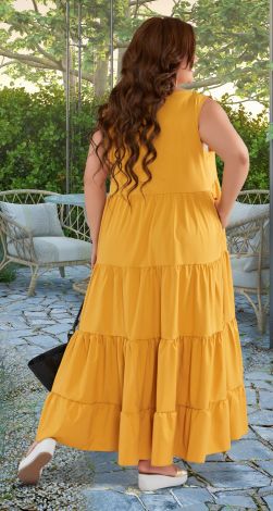 Loose bright sundress of large size with frills